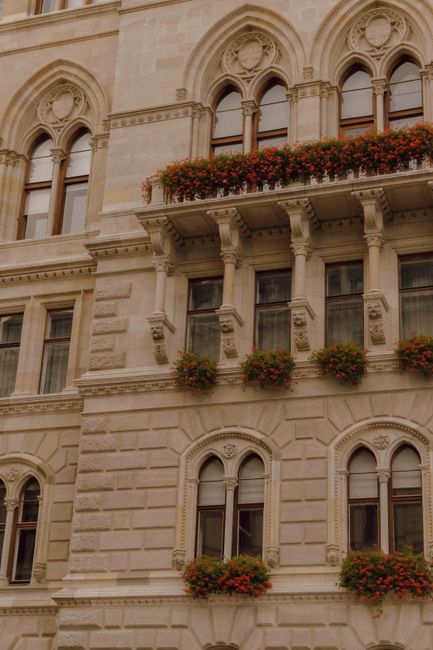 Ornate Vienna architecture with floral balconies in a classic style.