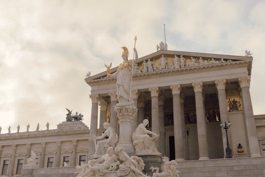 View of the Pallas Athene Fountain and Parliament Building in Vienna, Austria.