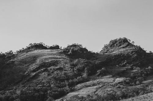 Free Black and white mountain view showcasing nature's rugged beauty. Stock Photo