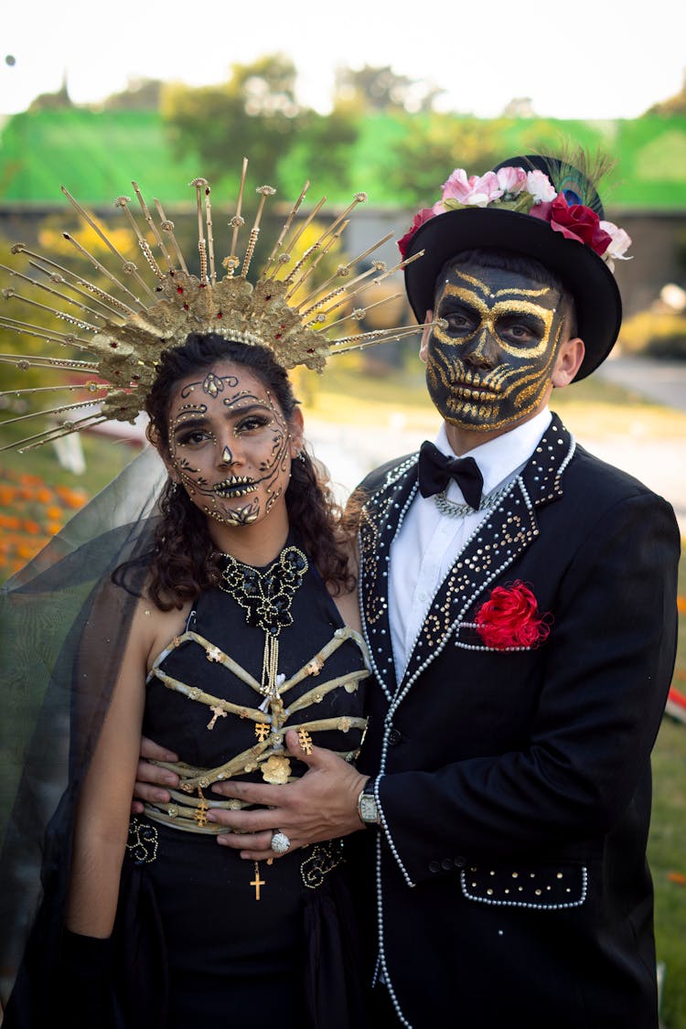 Man And Woman Wearing Dia De Los Muertos Makeups And Costumes