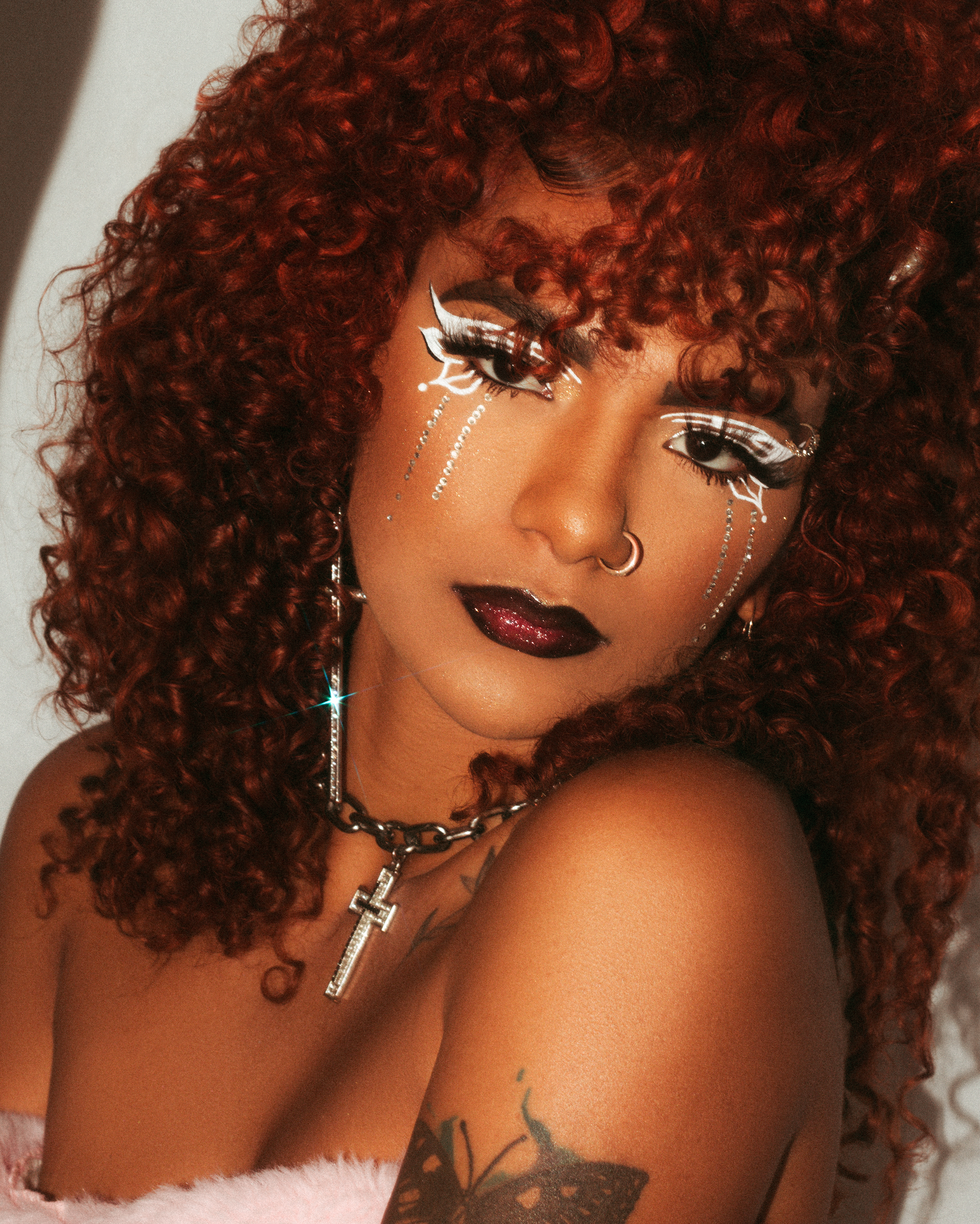 Photo of a Young Woman with Red Curly Hair and Makeup · Free Stock Photo