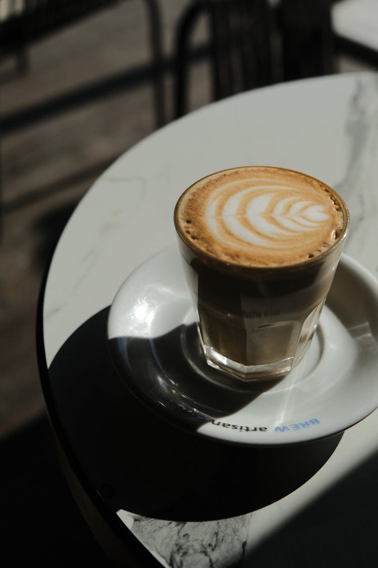 A Glass Of Latte On A Saucer 