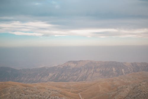 Aerial Photography of Mountains under the Cloudy Sky