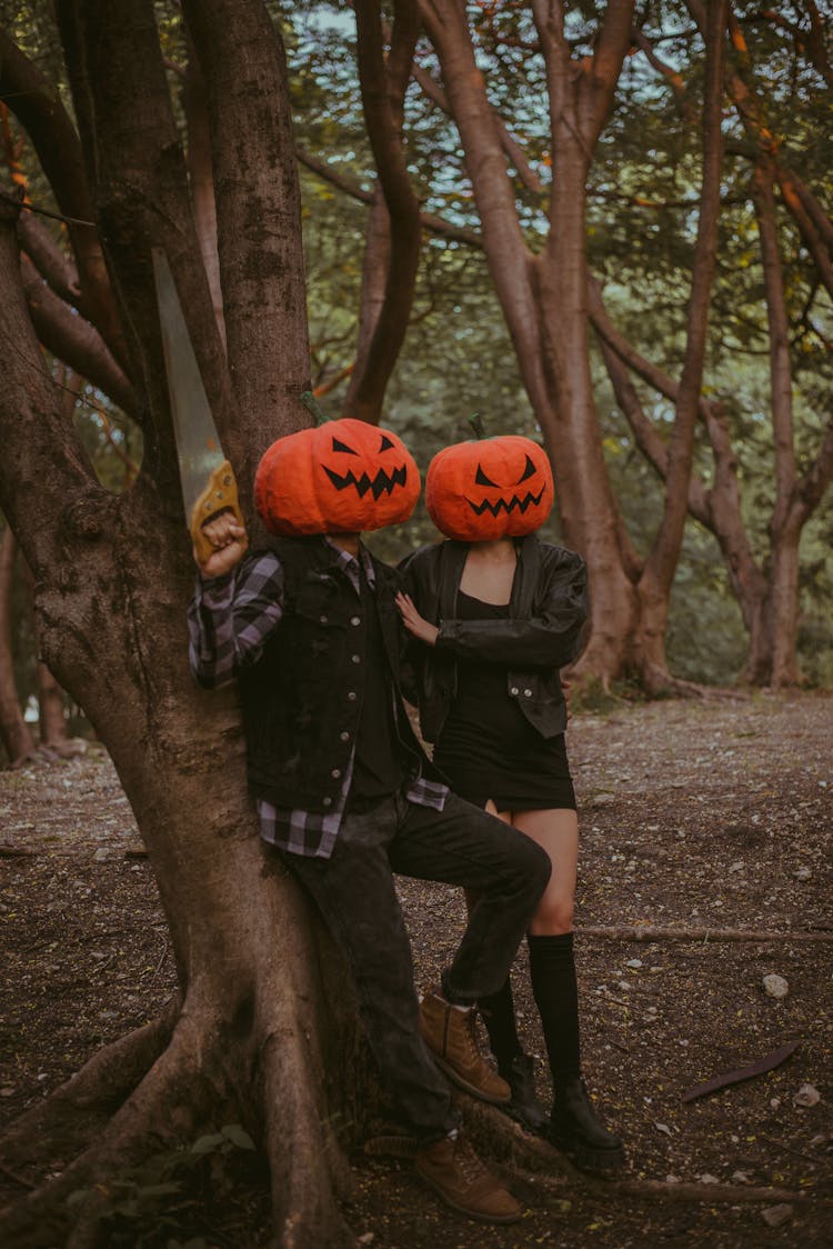 Couple Wearing Pumpkin Masks