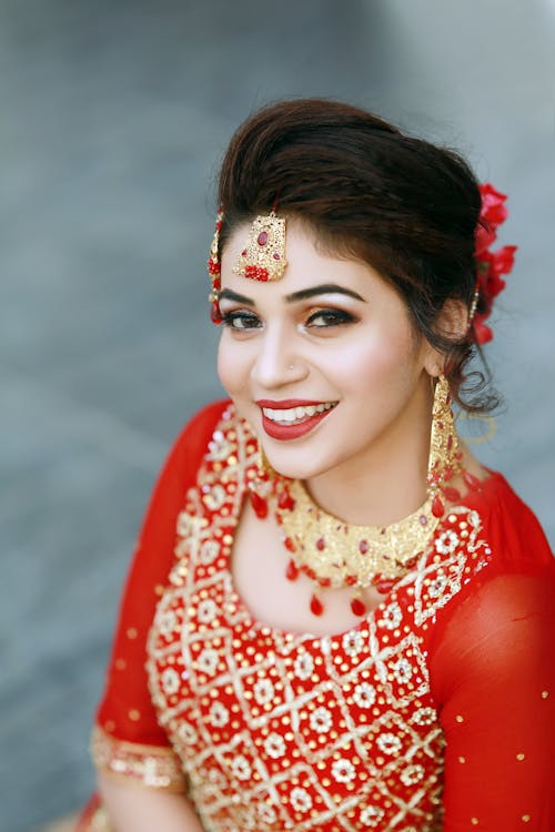 Portrait of a Beautiful Woman in Red Saree