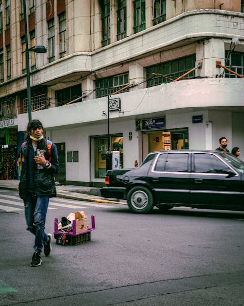 Man and Car on City Street