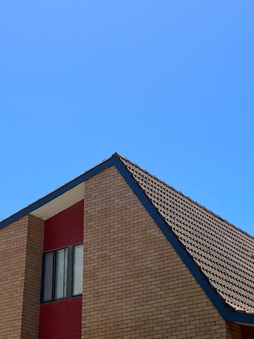 Gratis stockfoto met buitenkant van het gebouw, copyruimte, dak
