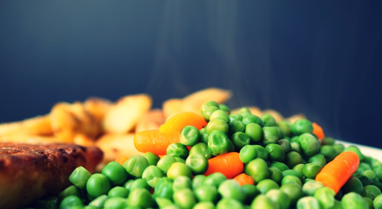 Close Up Photography of Green Beans on White Plate