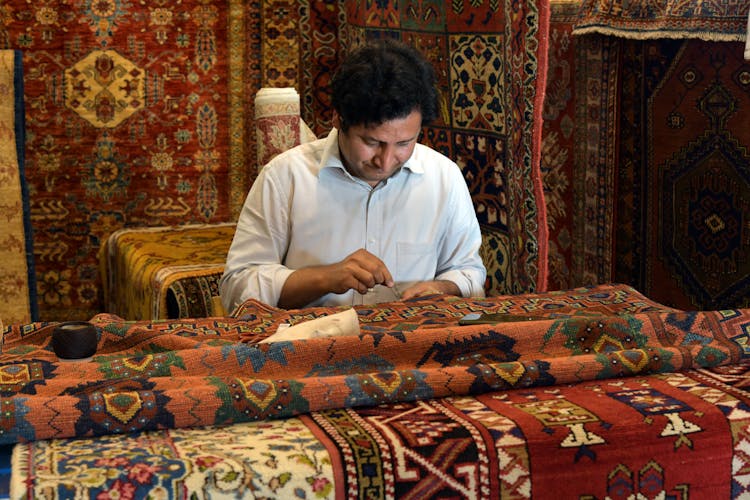 Photo Of A Working Carpetmaker