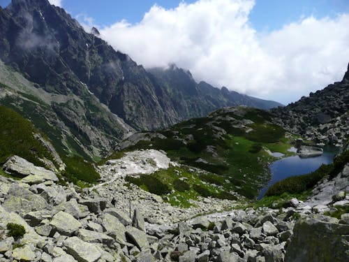 Green and Gray Mountain Under White Clouds