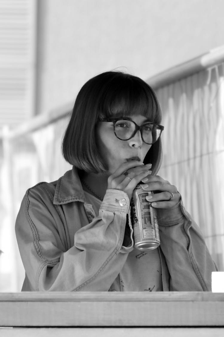 Grayscale Photo Of Woman Drinking