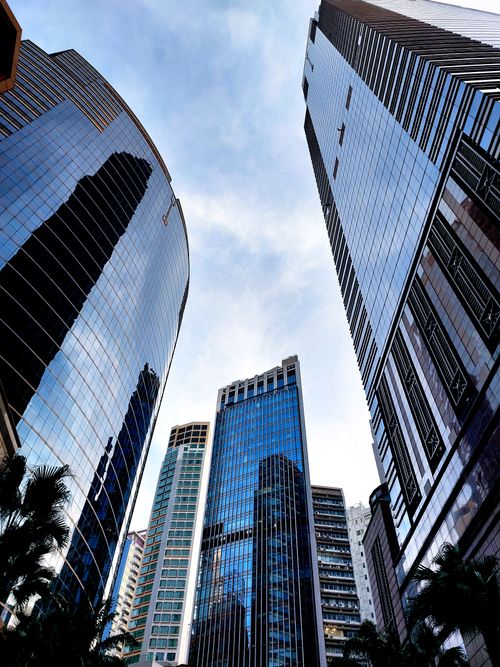 Free Low-angle view of modern skyscrapers in Hong Kong, capturing the urban landscape. Stock Photo
