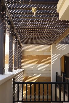 Modern architecture featuring striking light and shadow patterns indoors.