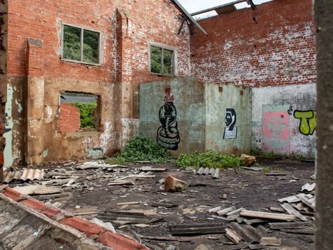 An abandoned building in Durban featuring vibrant graffiti on its dilapidated walls.
