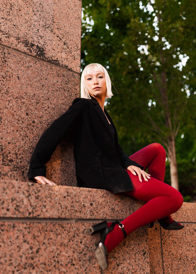 Blonde Fashion Girl In Red Tights And Black Jacket