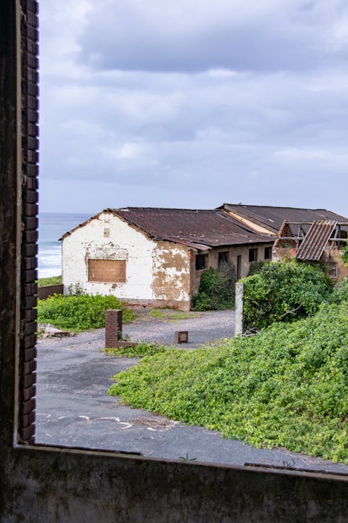 Free Abandoned Buildings Seen From a Window Stock Photo