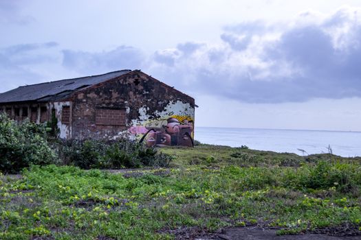 Abandoned building with graffiti near the sea in Durban, South Africa.