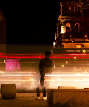 Blurred pedestrians and traffic lights in downtown Guadalajara, Mexico.