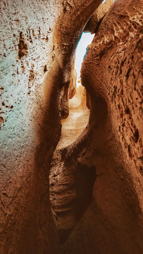 Free Explore a narrow rocky crevice in the captivating geology of Nevşehir, Turkey. Stock Photo