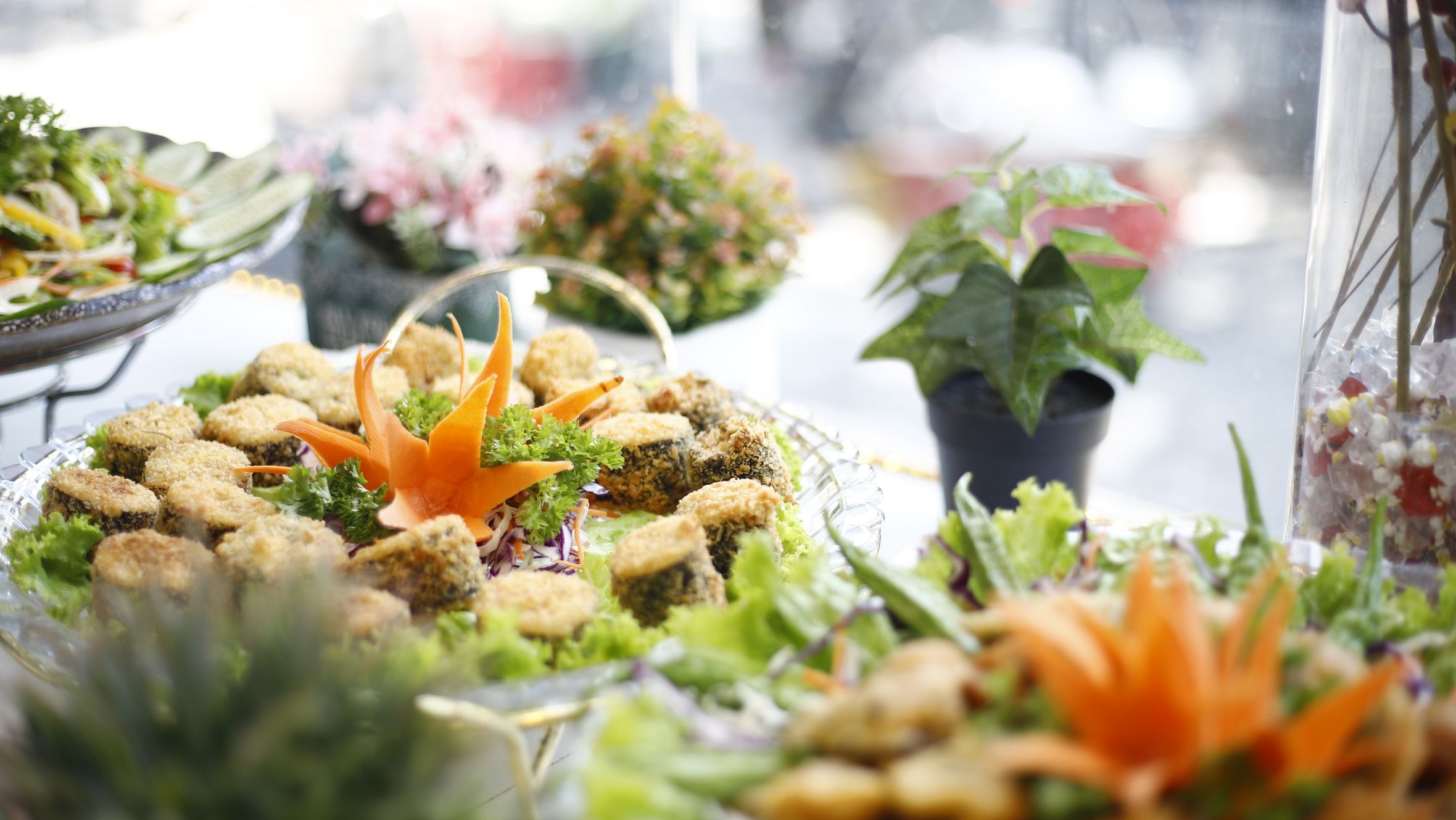 A beautifully presented platter of delicious appetizers with decorative garnishes in a Ho Chi Minh City restaurant.