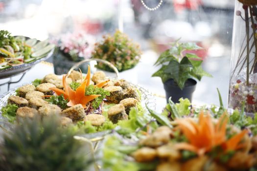 A beautifully presented platter of delicious appetizers with decorative garnishes in a Ho Chi Minh City restaurant.