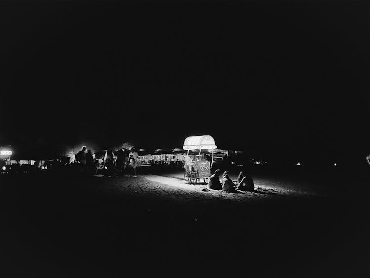 People On The Beach At Night