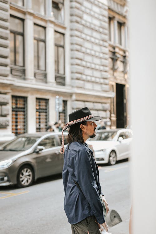 Woman in Black Long Sleeves Standing on the Street