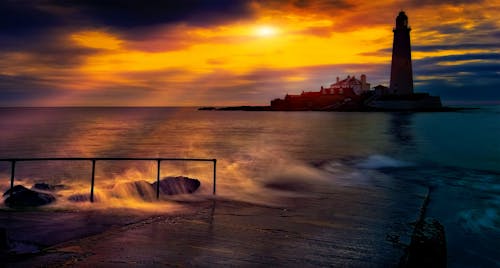 Foto profissional grátis de à beira-mar, alvorecer, beira-mar