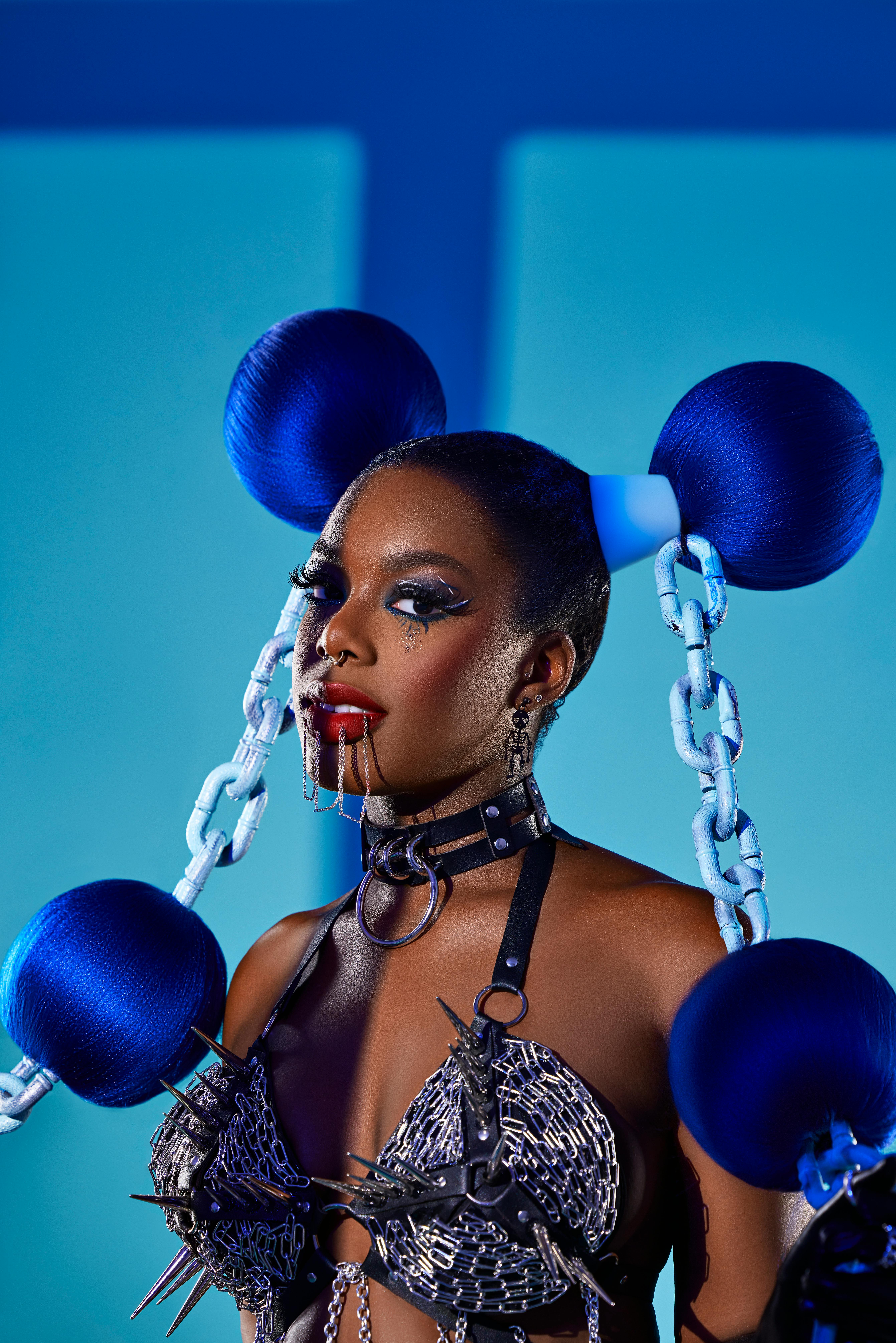 Black Model with Weird Blue Hair Wearing Chain Bra · Free Stock Photo