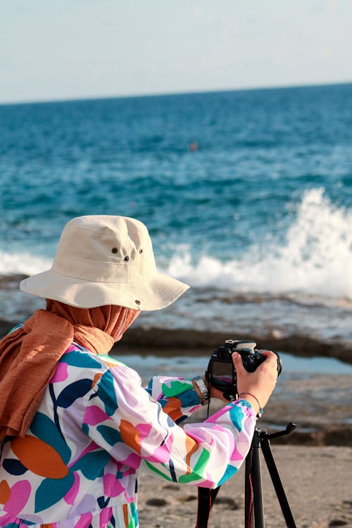 Woman in Printed Long Sleeves Taking a Picture