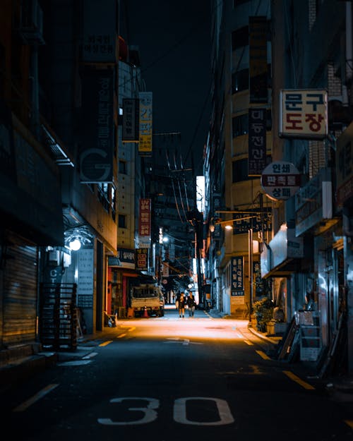 City Street Between Buildings at Night