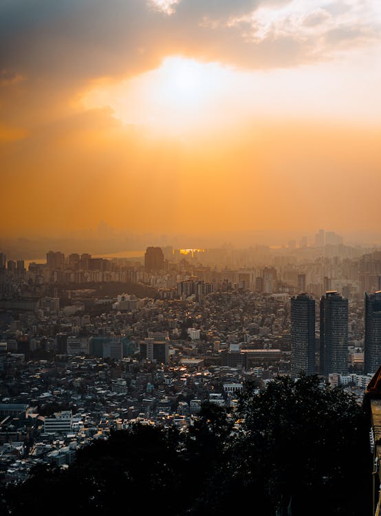 Aerial View of City Buildings during Sunset