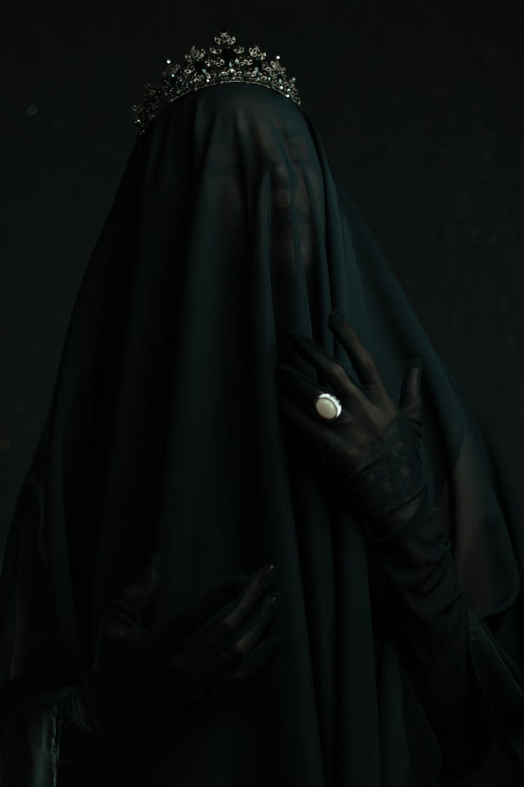 A Woman In Black Veil