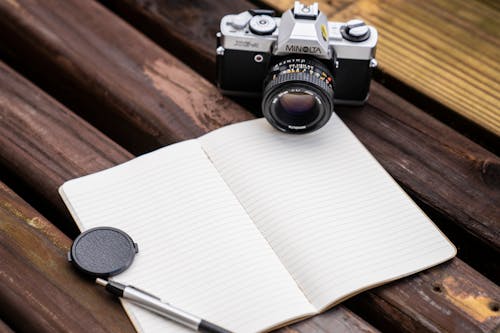 Minolta Camera Beside a Notebook