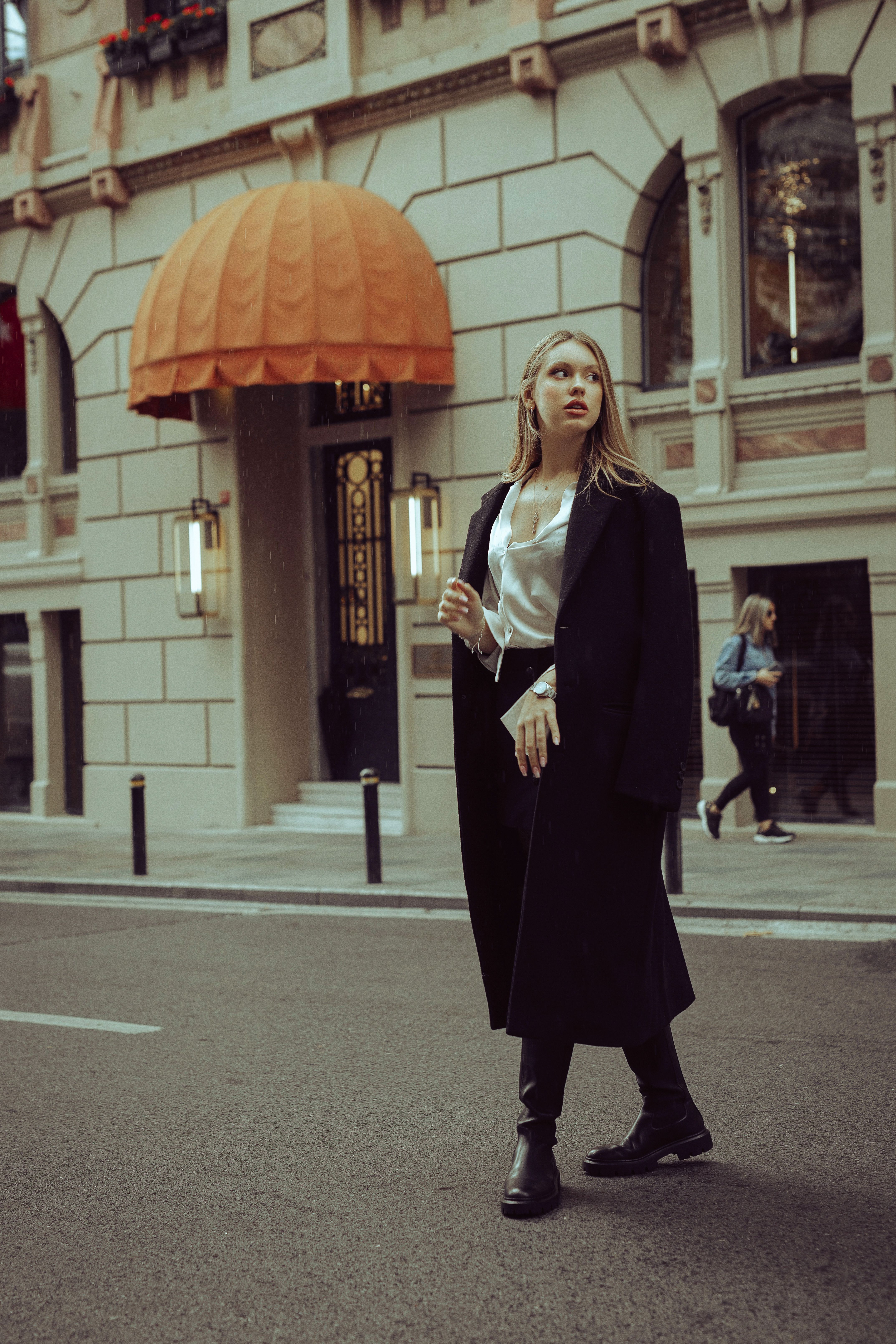 Woman in Black Coat Standing in the Middle of the Road · Free Stock Photo