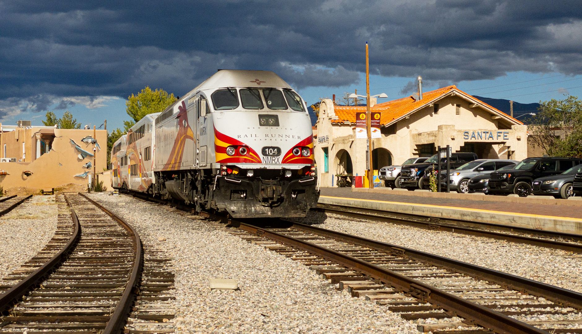 Rail Runner Express train arriving in Santa Fe, NM under dramatic skies.