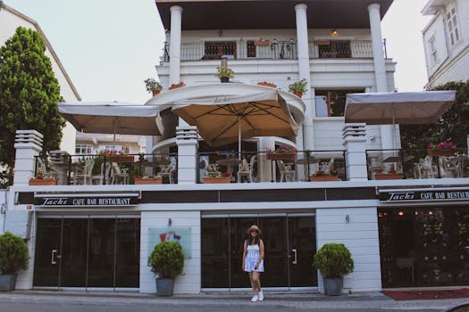 Elegant cafe in Adalar, Istanbul with terrace seating and street view.