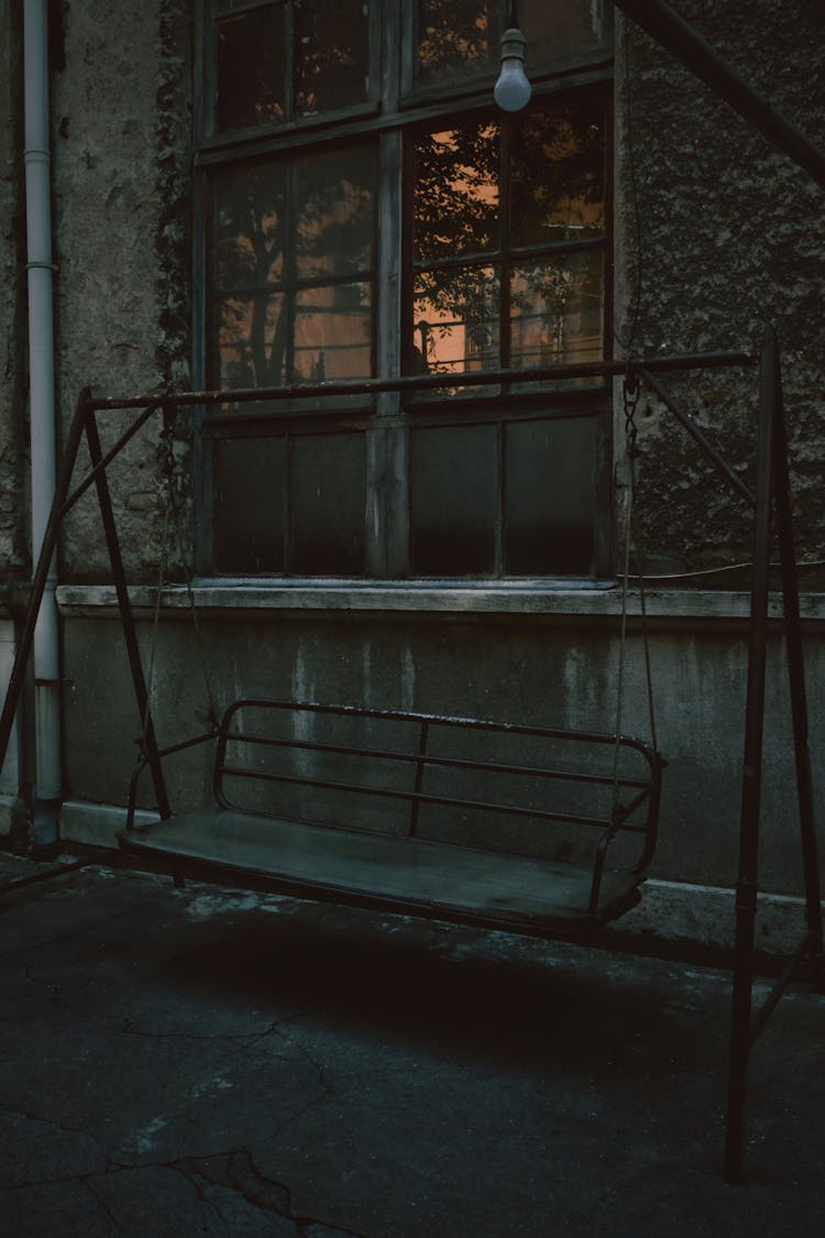 Metal Swing Chair Near A Window