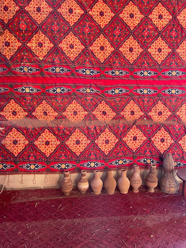 Person Wearing Brown Boots Standing on Brown Wooden Floor