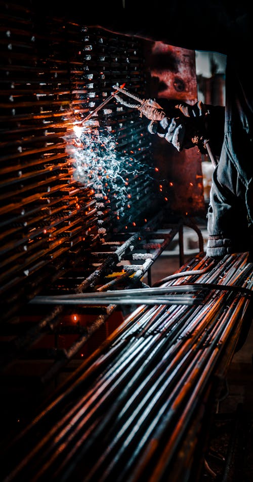 A Person Welding Metals