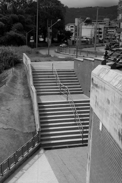 Grayscale Photo of a Concrete Staircase