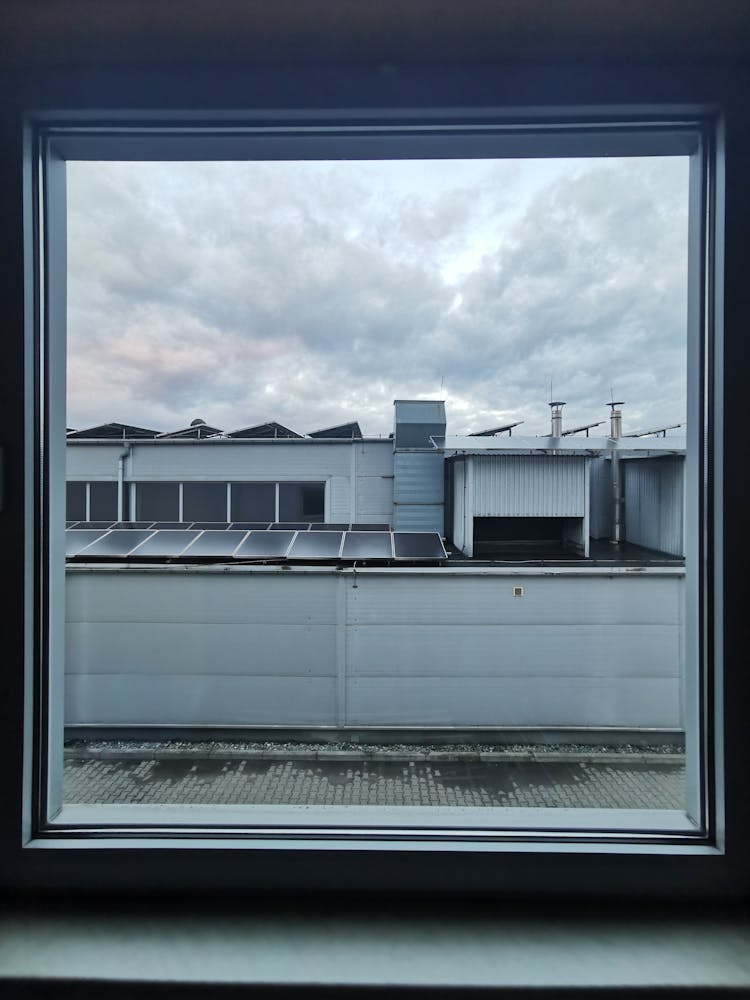 View Of An Industrial Buildings From A Window 