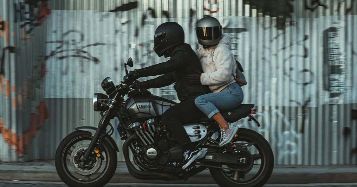 2 People Ride Motorcycle Two People Riding on a Motorcycle · Free Stock Photo