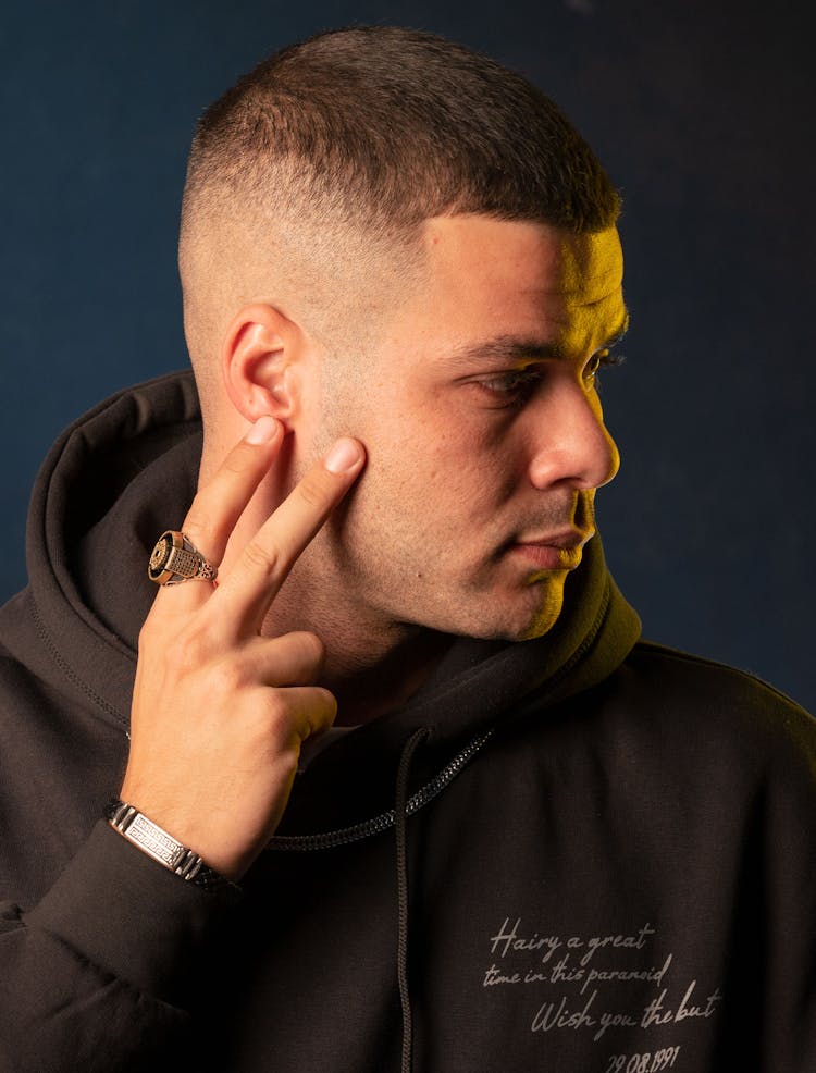 Young Man In Brown Hoodie