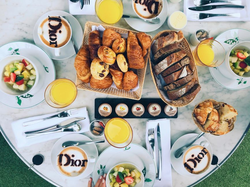 Luxurious French breakfast setup with pastries, coffee, and juice in a stylish setting. Great for lifestyle and food visuals.