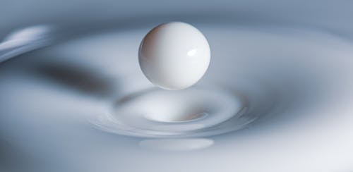 Closeup of bouncing milk droplet