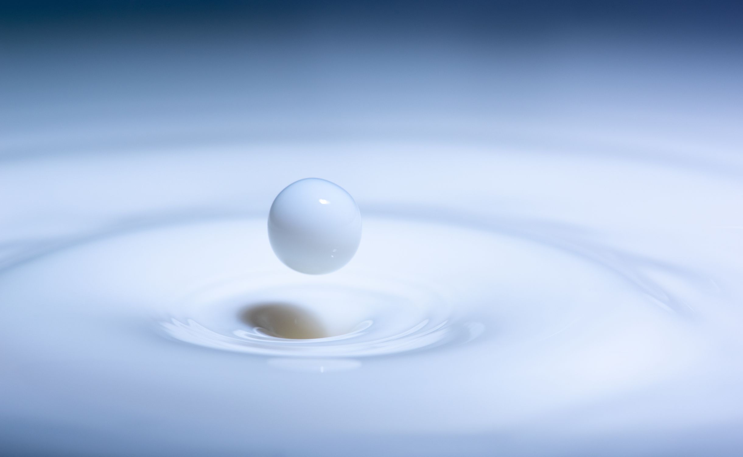 Close-Up Shot of a Drop of Milk · Free Stock Photo