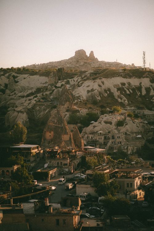 Free Discover the stunning rock formations and historical village landscape of Göreme, Nevşehir, Turkey. Stock Photo