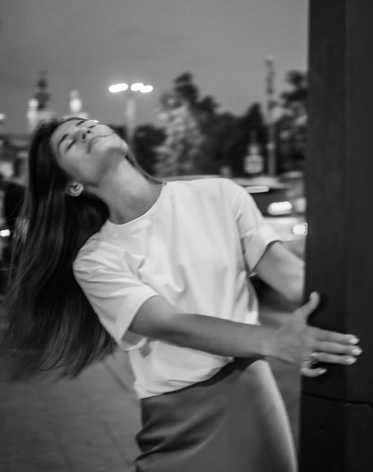 Woman In White T-Shirt On Street