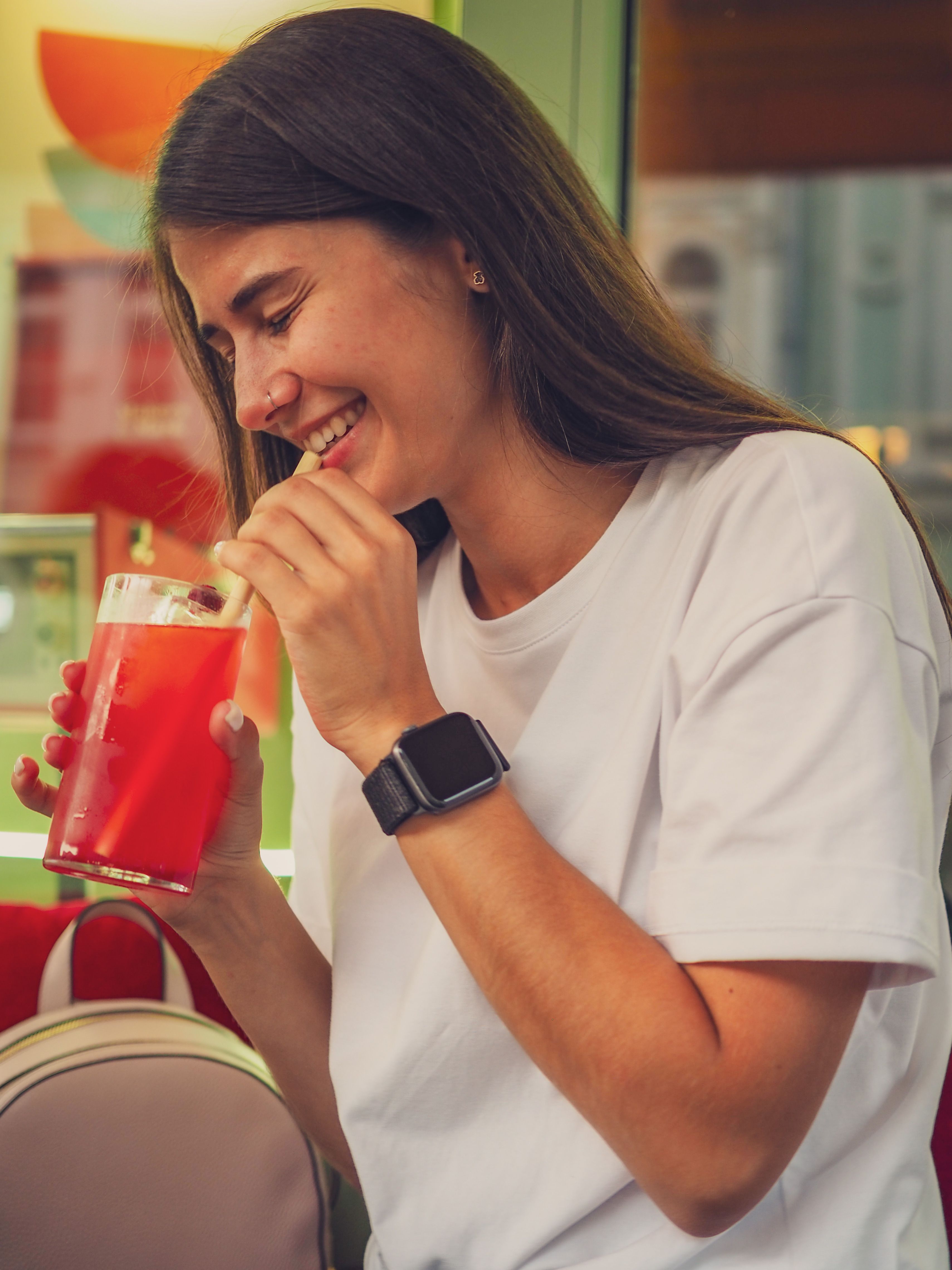 Woman in White Shirt Holding a Drink · Free Stock Photo